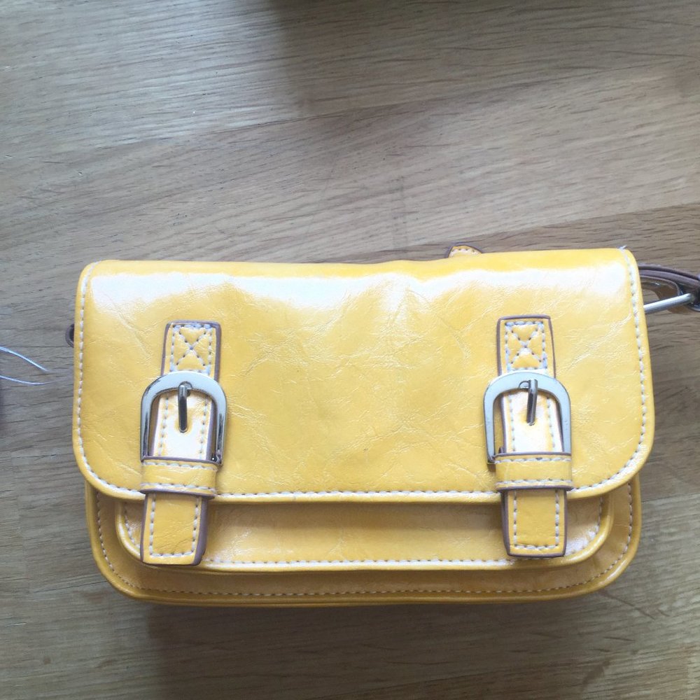 NWT Nygard crossbody purse. Color is yellow